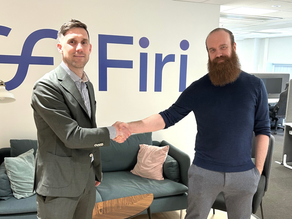 Handshake Firi CEO Magnus Holst from River Security meeting with CTO Cato Auestad at Firi headquarters.