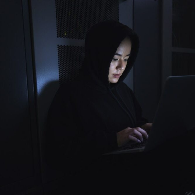hacker-server-room-and-person-on-laptop-for-codin